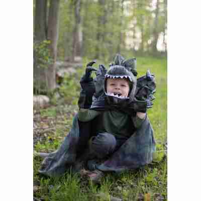 Enfant portant la cape de Dilophosaurus avec griffes assorties