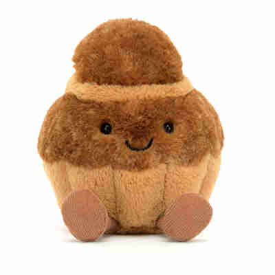 Détail du visage souriant de la peluche Amuseables Brigitte Brioche Jellycat