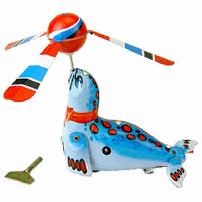 Phoque mécanique en métal bleu avec ballon à hélice et mécanisme à clef