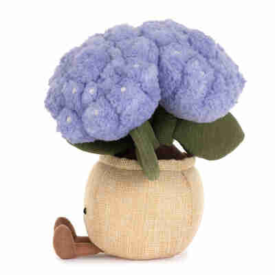Amuseables Hydrangea Jellycat vu de profil avec fleurs bleues, feuilles vertes et petit pied brun