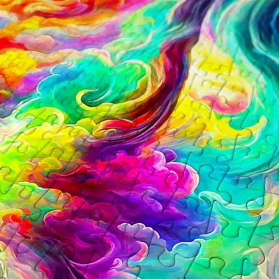 Gros plan sur les pièces colorées du puzzle Enjoy All My Dreams et leurs formes variées